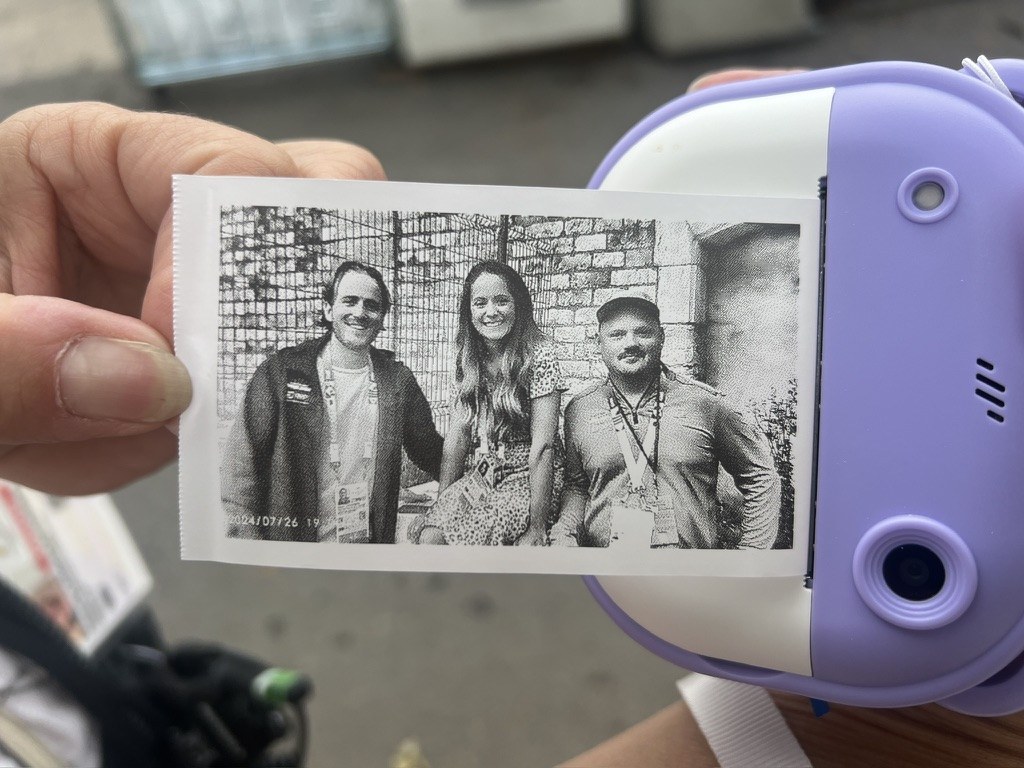A printed team portrait from Paris 2024