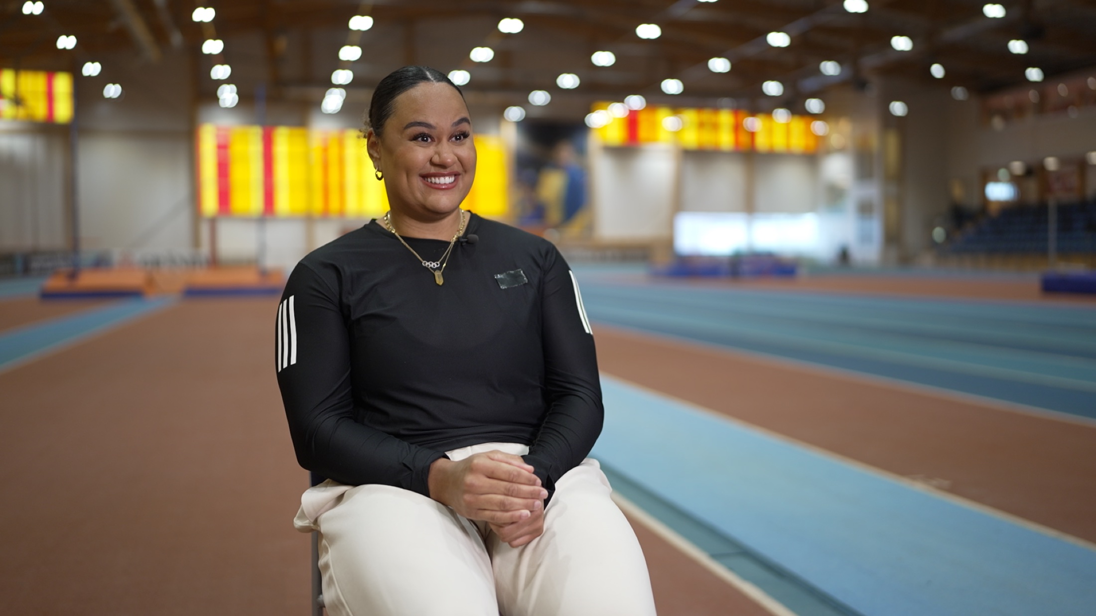 Athlete interviewed in an indoor arena