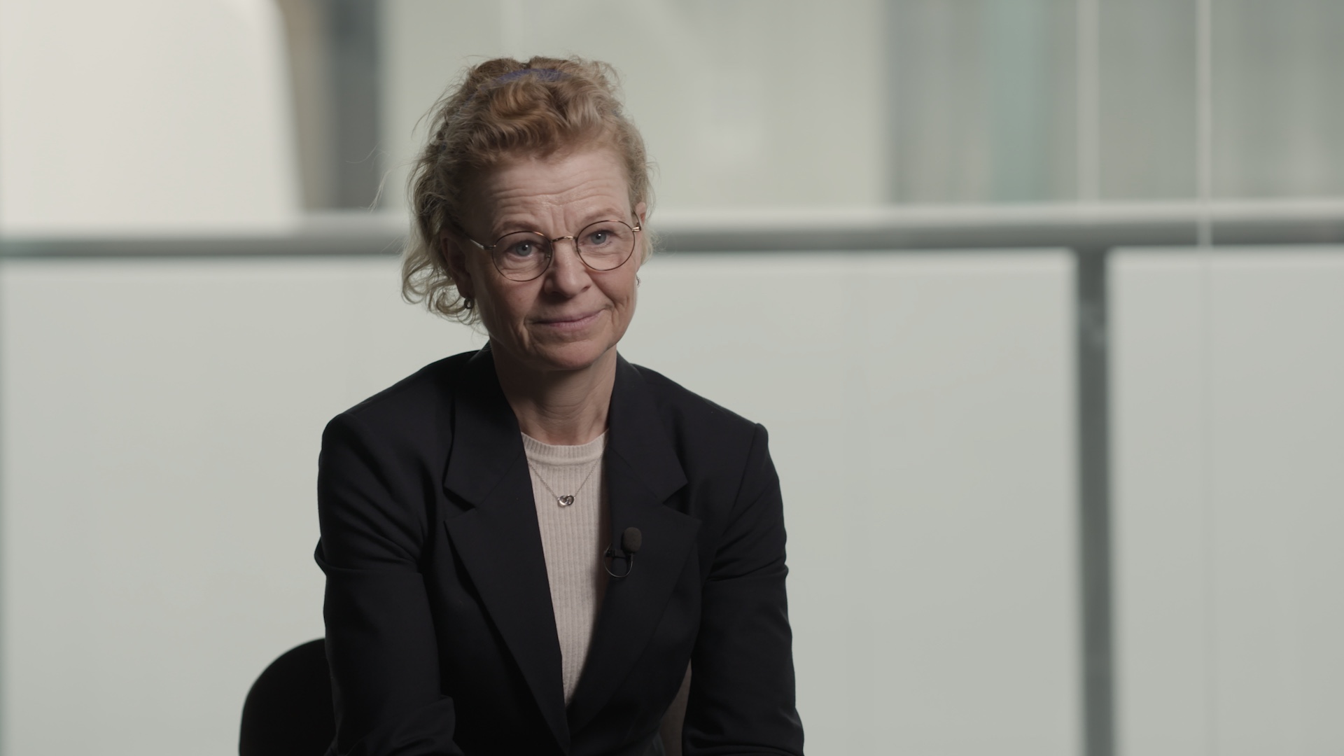 Interview portrait in a bright architectural setting