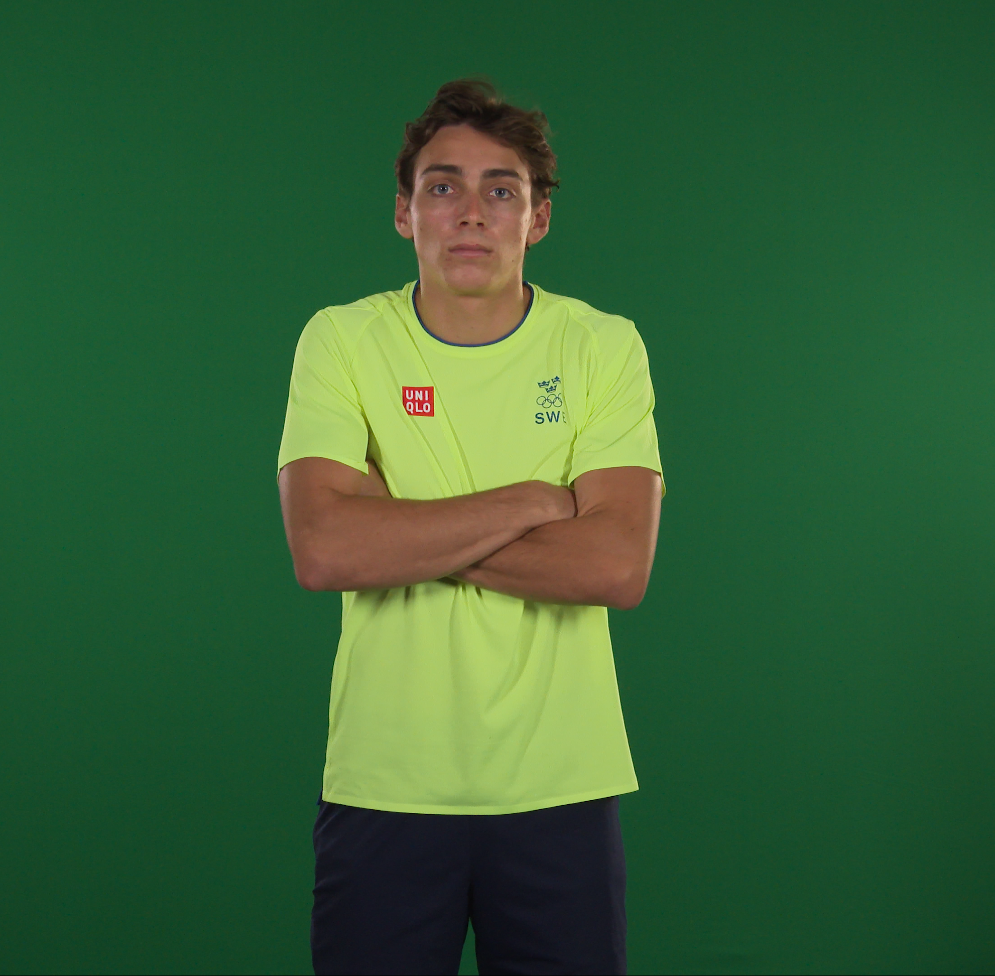 Swedish athlete against a green backdrop
